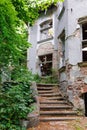 Exterior with stairs of an old abandoned mansion Royalty Free Stock Photo