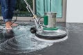 Exterior stone floor cleaning with polishing machine and chemica Royalty Free Stock Photo