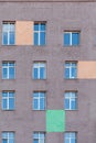 The exterior of a tall building with windows. A newly built building Royalty Free Stock Photo