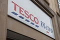 Exterior of Tesco Metro supermarket and grocery shop.  Showing logo, sign, signage and branding of company branches Royalty Free Stock Photo