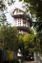 Exterior tower building with king of serpent naga and chinese dragon for thai people travel visit respect praying of Wat Samphran