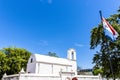 Exterior of the V.O.C. Kruithuis powder magazine and the VOC flag in Stellenbosch, Western Cape, South Africa Royalty Free Stock Photo