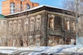 Exterior view of an abandoned wooden house, boarded up windows, in city . poverty and horror concept