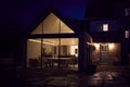 Exterior View Of Beautiful Kitchen Extension At Night Royalty Free Stock Photo