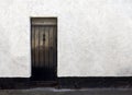 Exterior View of a Beautiful Old English Stone Cottage with door. Royalty Free Stock Photo