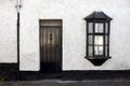 Exterior View of a Beautiful Old English Stone Cottage with door and window. Royalty Free Stock Photo