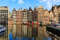 Exterior view of buildings at Damrak street in the old town part Royalty Free Stock Photo