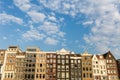 Exterior view of buildings at Damrak street in the old town part Royalty Free Stock Photo