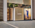 Exterior view of a Burberry store and company logo in the huge luxurious mall