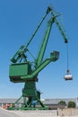 Exterior view of a cement factory with green crane