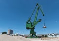 Exterior view of a cement factory with green crane Royalty Free Stock Photo