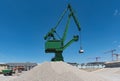 Exterior view of a cement factory with green crane Royalty Free Stock Photo