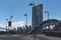 Exterior view of a cemthe honsell bridge with new building of the european central bank ezb in Frankent factory with green crane Royalty Free Stock Photo