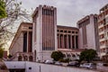 Areeiro, Lisbon PORTUGAL - March 17, 2022 - Tree branches in blur with CGD headquarters building at evening