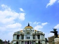 exterior view of the facade of the Palace of Fine Arts in Mexico City during the day