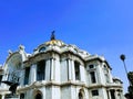 exterior view of the facade of the Palace of Fine Arts in Mexico City during the day