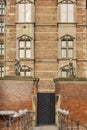 Exterior view of the famous Rosenborg Slot with many pigeons sitting