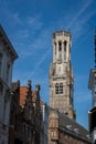 Exterior view of the iconic Belfry of Bruges tower in the historic city of Bruges in Belgium.