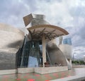 Exterior view at the iconic Guggenheim Museum Bilbao, an iconic museum of modern and contemporary art, Nervion river and Bilbao Royalty Free Stock Photo