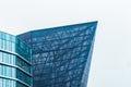 Exterior view of modern business center glass geometric city office facade Royalty Free Stock Photo