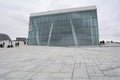 Oslo, Norway, September 2022: Exterior view of the modern Oslo Opera House building, with people walking on the roof. Royalty Free Stock Photo