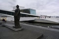 Oslo, Norway, September 2022: Exterior view of the modern Oslo Opera House building, with people walking on the roof. Royalty Free Stock Photo