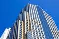 Exterior view of modern tall skyscraper building against blue sky Royalty Free Stock Photo