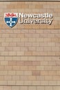 Exterior view of Newcatsle University building showing logo, signage and branding for the university Royalty Free Stock Photo