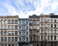 Exterior view of old apartment buildings in the SoHo neighborhood of Manhattan in New York City with empty blue sky Royalty Free Stock Photo