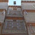 Exterior view of old houses in Rosetta made of colored bricks and wooden arabesque windows