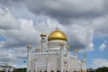 Exterior view of Omar Ali Saifuddien Mosque, Brunei, with a golden-domed roof and a metallic fence Royalty Free Stock Photo