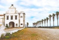 Exterior view of the ornate Style Convent Orada catholic church in Portugal surrounded by palm trees