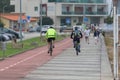 Exterior view at the Pedestrian Cyclo path on Torreira, two man on backs cycling on this path and a senior couple walking ,