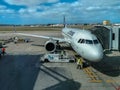 Exterior view of the runway and lift and maintenance of aircraft at Lisbon airport with airplanes and cargo