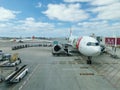 Exterior view of the runway and lift and maintenance of aircraft at Lisbon airport with airplanes and cargo