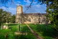 Exterior view of St Michael and All Angels` Church and grave yard in Melksham, Witlshire, UK