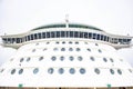 Exterior view of a tall luxury cruise ship tower illuminated by the sun