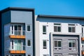 Exterior view of top level floors of typical new multifamily mid-rise residential building Royalty Free Stock Photo