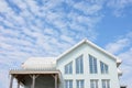 Exterior view of a triangular window design, irregular shape windows of the second level space, veranda, loft or attic of a light