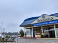 Exterior view of Uwajimaya Asian Grocery store front as customers are entering and exiting