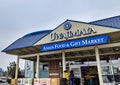 Exterior view of Uwajimaya Asian Grocery store front as customers are entering and exiting