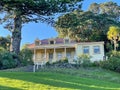 Exterior view of Vaughan Historic Homestead in a sunny day, Long Bay Regional Park, Auckland, New Zealand Royalty Free Stock Photo