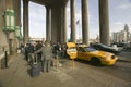 Exterior view of yellow taxi cab in front of the 30th Street Station, a national Register of Historic Places, AMTRAK Train Statio