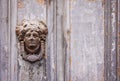 Exterior vintage door knocker metal circle on a door of an ancient building in Catania, Sicily, Italy Royalty Free Stock Photo