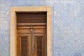 Exterior wall of a residential building with traditional portuguese tiles and entrance door in the Bairro Alto district in the old Royalty Free Stock Photo