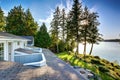 Exterior of waterfront house with a pier and perfect water view.