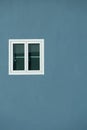Exterior white glass window on blue cement wall architecture background Royalty Free Stock Photo