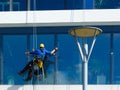 exterior window washing activity. high-rise glass and aluminum curtain wall elevation Royalty Free Stock Photo