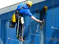 Exterior window washing activity. high-rise glass and aluminum curtain wall elevation Royalty Free Stock Photo