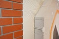 External brick wall insulation. House brick wall insualtion with glue plastering layers,  reinforcment mesh, aerated concrete Royalty Free Stock Photo